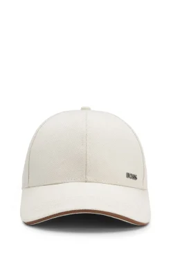 Cap aus Baumwoll-Canvas mit Lederbesatz