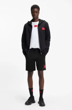 Shorts aus Baumwoll-Terry mit rotem Logo-Label