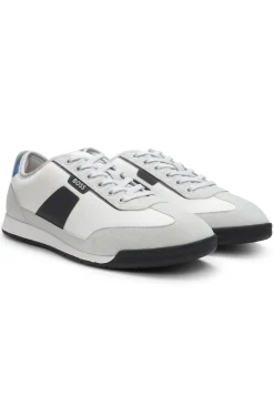 Sneakers aus verschiedenen Materialien mit gerippter Laufsohle